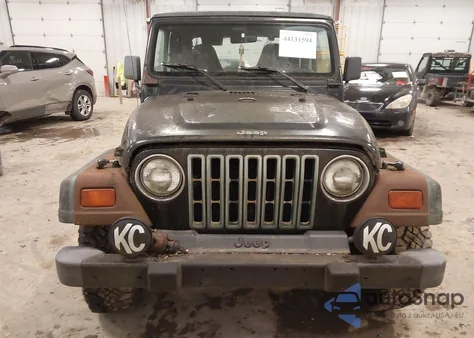 1998 Jeep Wrangler Sport z USA, uszkodzony, nr VIN 1J4FY19S7WP740040